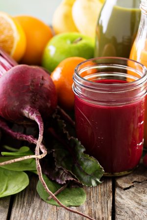 Variety of fresh vegetable and fruit juices Variety of fresh vegetable and fruit juices in bottles and mason jar